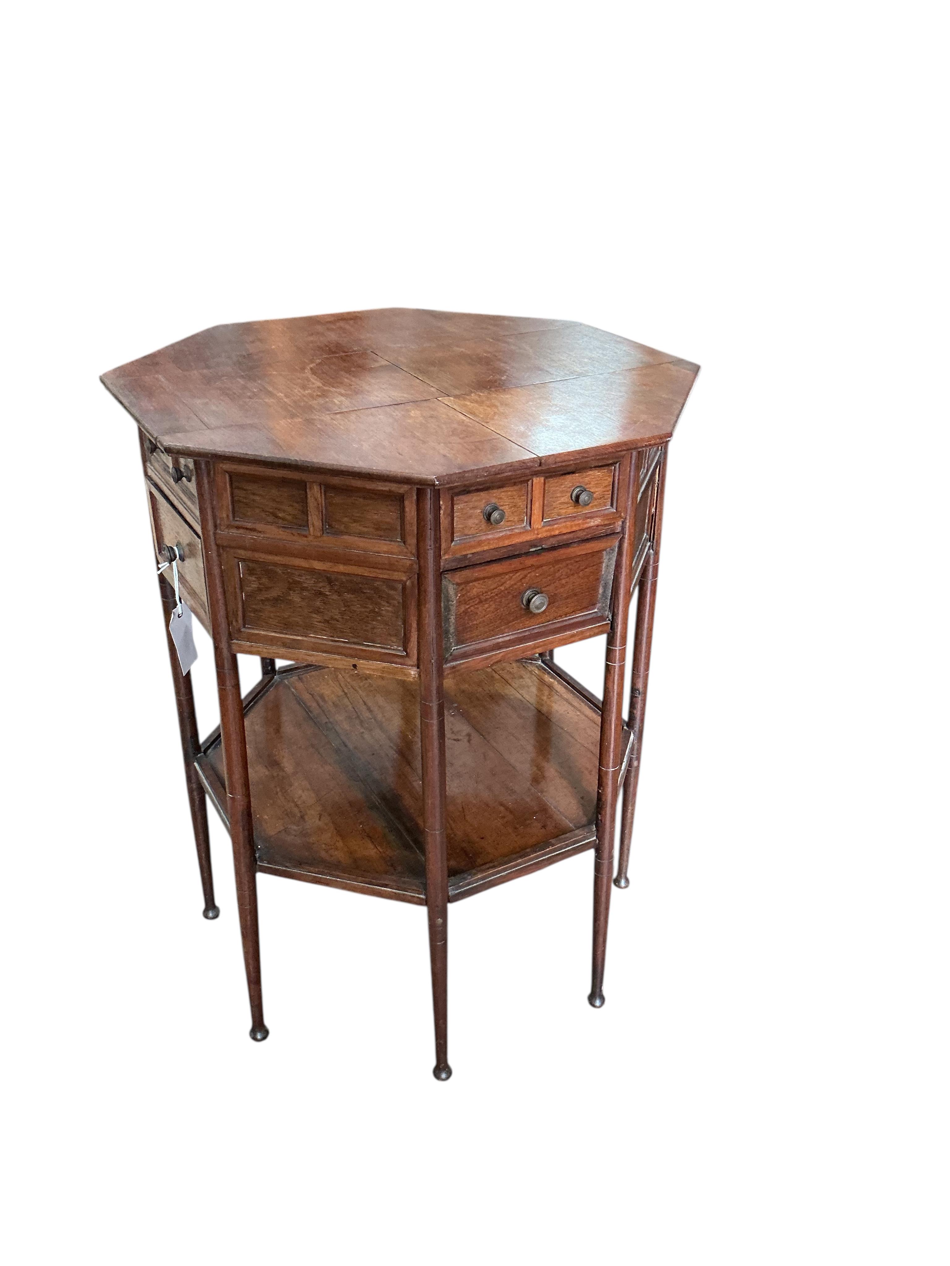 A late Victorian octagonal rosewood two tier work table, width 54cm, height 68cm